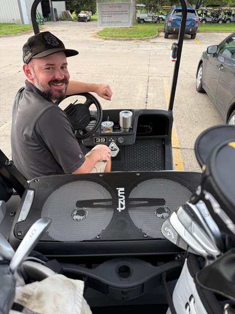 Carson brought a little Bluetooth speaker to golf today.